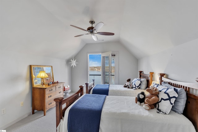 bedroom featuring ceiling fan, vaulted ceiling, and carpet