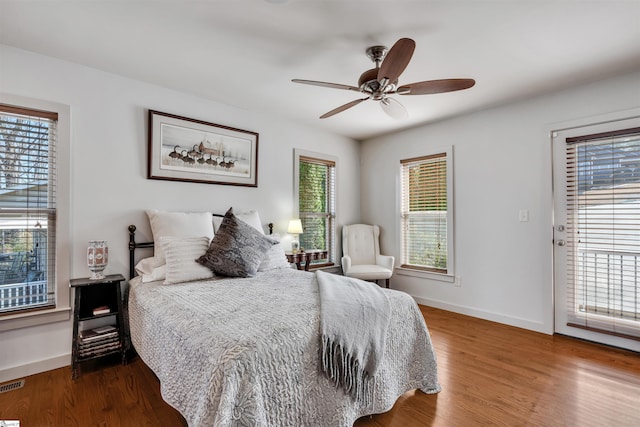 bedroom with wood-type flooring and ceiling fan