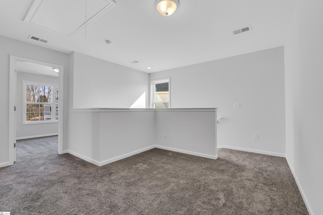 carpeted spare room with plenty of natural light