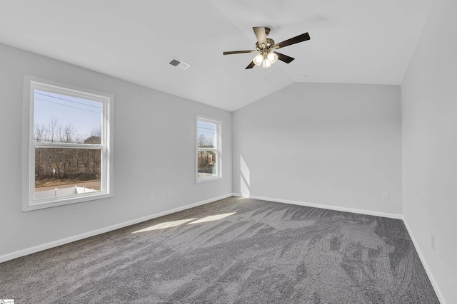 unfurnished room featuring vaulted ceiling, carpet, and ceiling fan