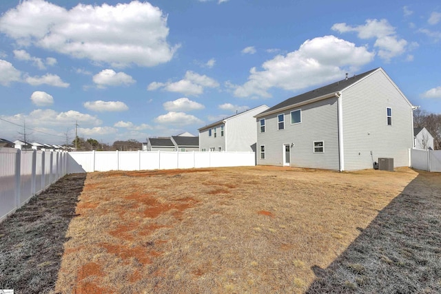 back of property featuring central AC