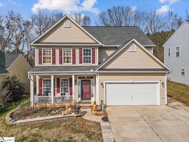 view of front of house with a garage and covered porch