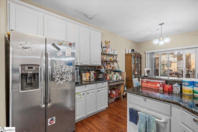 kitchen with white cabinetry, a chandelier, dark hardwood / wood-style flooring, hanging light fixtures, and stainless steel fridge with ice dispenser