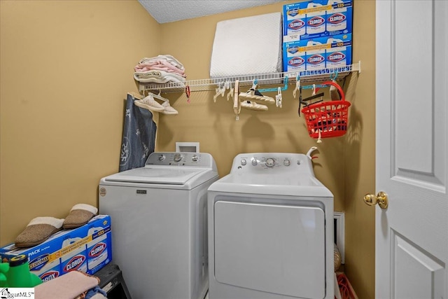 laundry room featuring separate washer and dryer