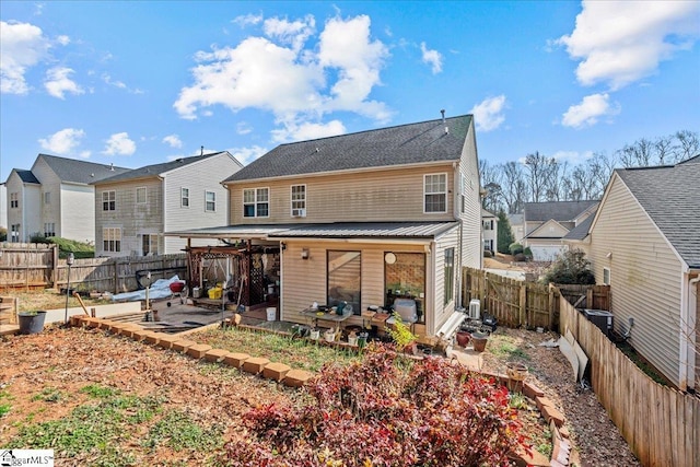 back of house with a patio