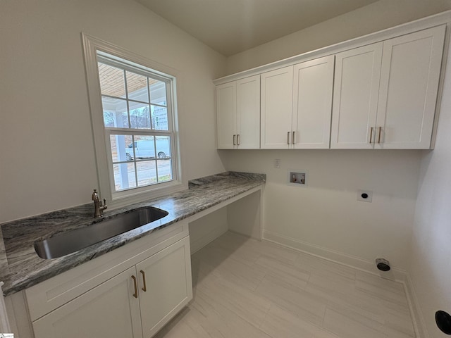 washroom with cabinets, hookup for a washing machine, sink, and electric dryer hookup