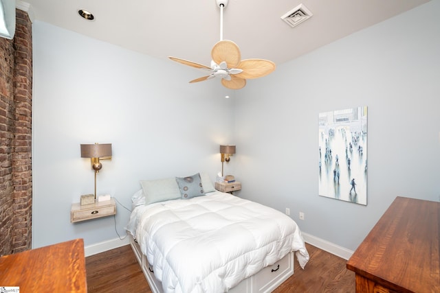 bedroom featuring dark hardwood / wood-style flooring and ceiling fan