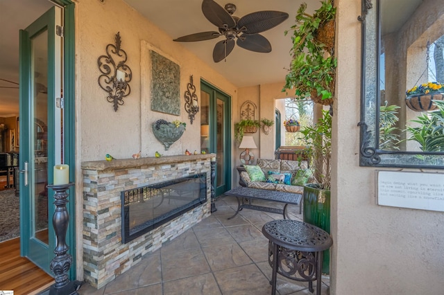 view of patio / terrace featuring ceiling fan