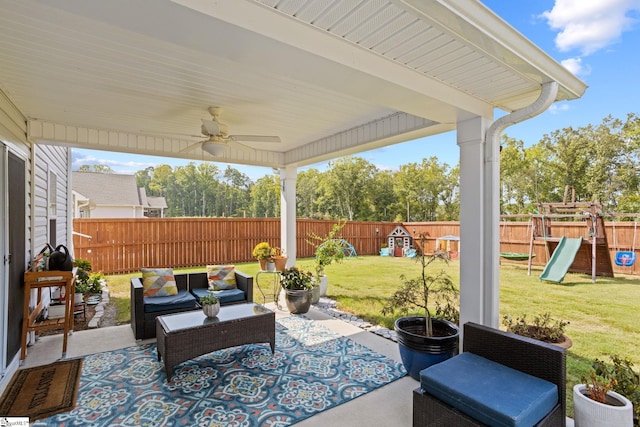 view of patio / terrace featuring ceiling fan, an outdoor living space, and a playground