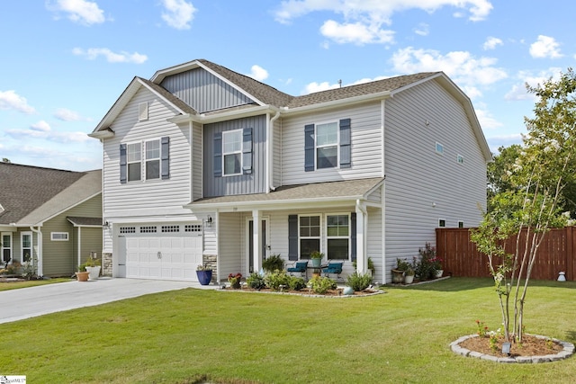 craftsman-style home featuring a garage, covered porch, and a front yard