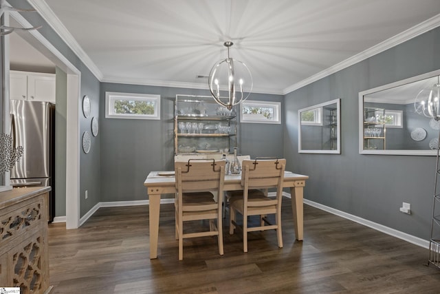 dining area with crown molding, dark wood-type flooring, and a chandelier