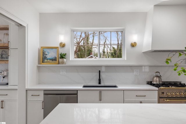 kitchen with white cabinetry, sink, and stainless steel appliances