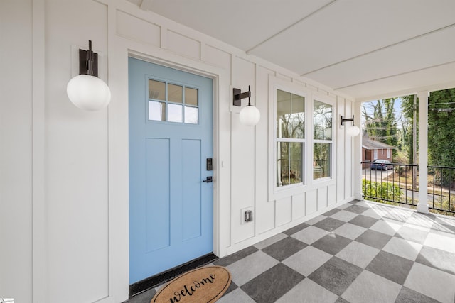 doorway to property with a porch