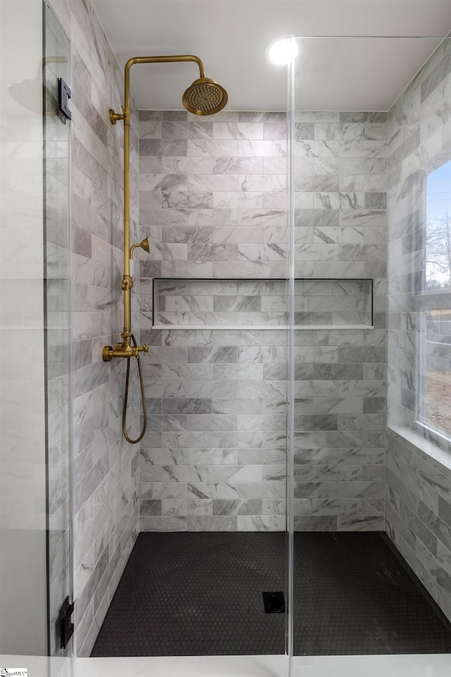 bathroom featuring an enclosed shower