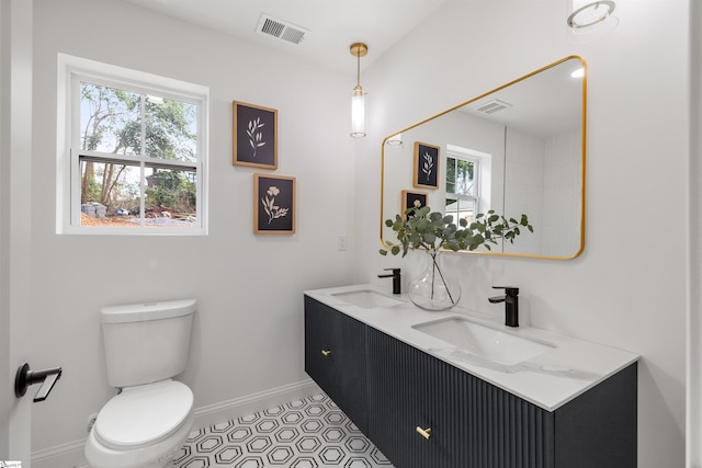 bathroom with vanity and toilet