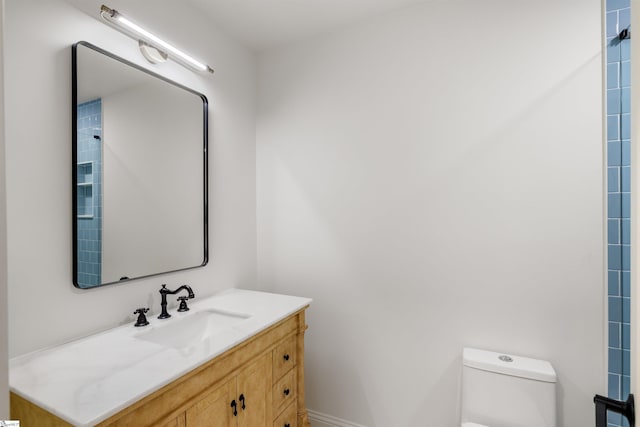 bathroom with vanity and toilet