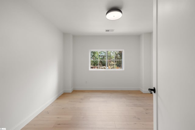 spare room with light wood-type flooring