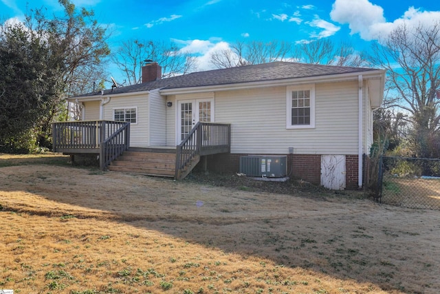 back of house with a yard, cooling unit, a deck, and french doors