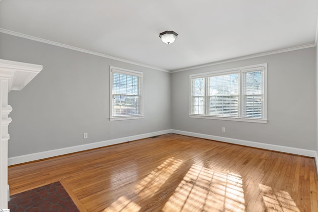 unfurnished room with hardwood / wood-style flooring and ornamental molding