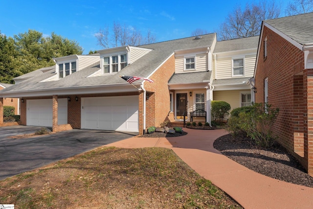 view of front of property featuring a garage and a porch