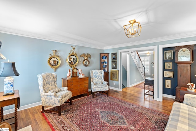 interior space featuring hardwood / wood-style flooring, ornamental molding, and a chandelier