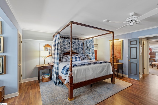 bedroom featuring crown molding, ceiling fan, and hardwood / wood-style floors