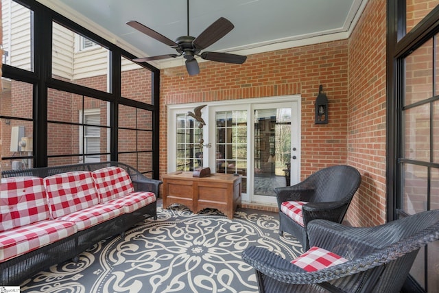 sunroom featuring plenty of natural light and ceiling fan