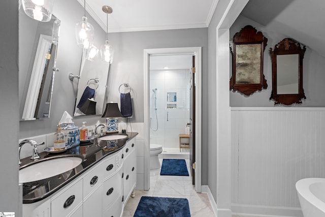 bathroom featuring crown molding, tiled shower, vanity, and toilet