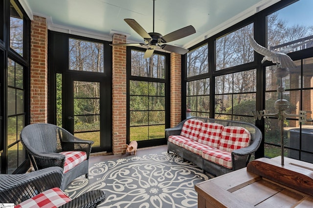 sunroom featuring ceiling fan