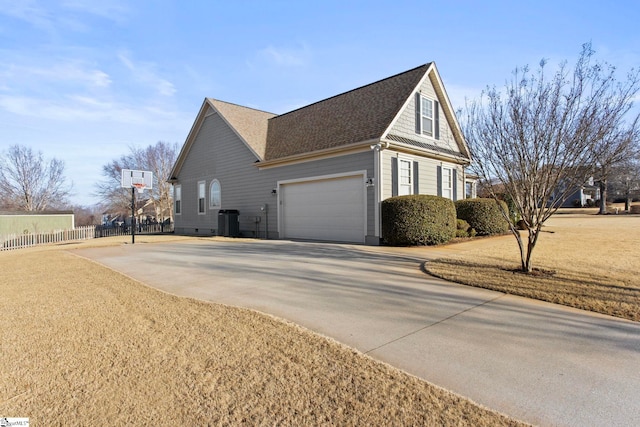 view of property exterior featuring a garage, a yard, and central air condition unit