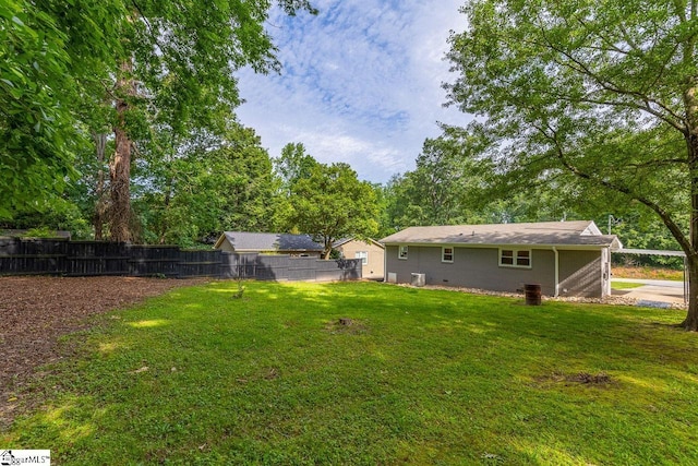 view of yard featuring cooling unit and fence