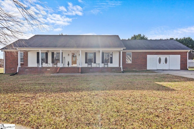 ranch-style home featuring a porch, brick siding, a front lawn, and crawl space