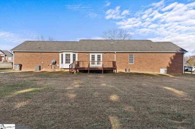 rear view of property with a wooden deck, a yard, central AC, crawl space, and brick siding