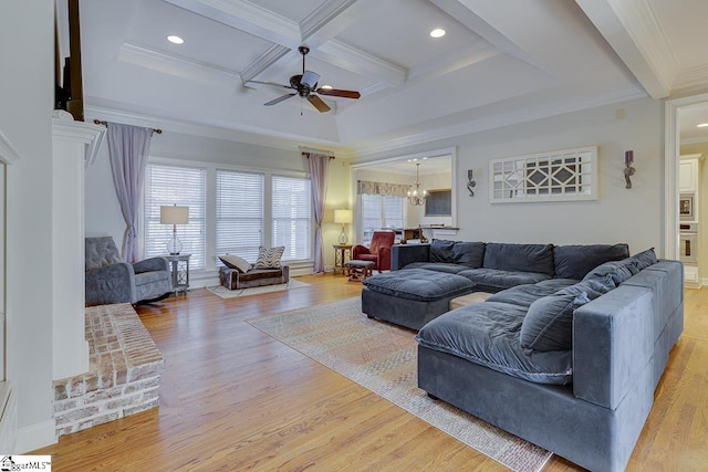 living room featuring crown molding, light hardwood / wood-style flooring, beam ceiling, coffered ceiling, and ceiling fan with notable chandelier