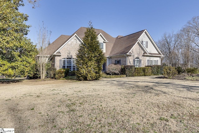 front facade with a front lawn