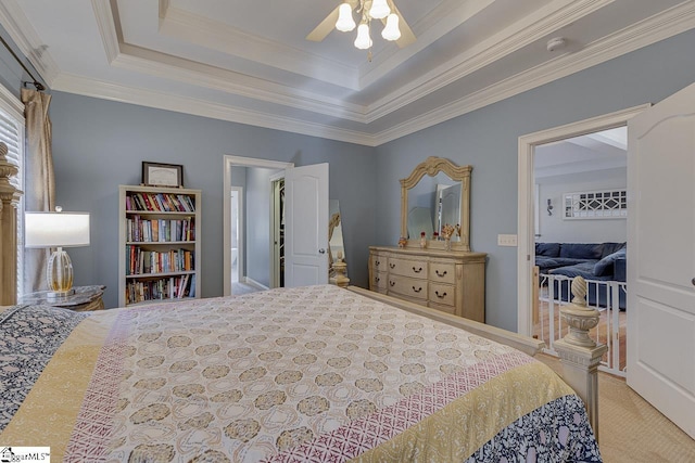 bedroom featuring ceiling fan, light colored carpet, ornamental molding, and a raised ceiling