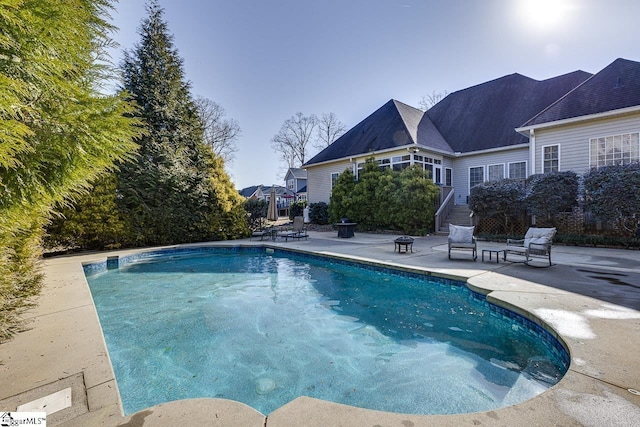 view of swimming pool featuring a patio