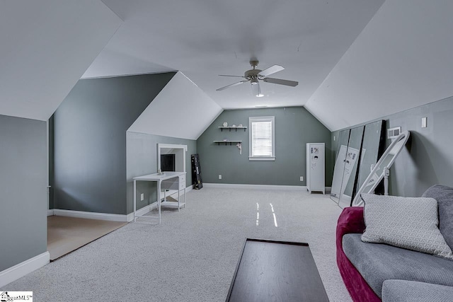 additional living space with lofted ceiling, carpet floors, and ceiling fan