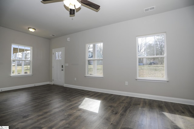 interior space with ceiling fan and dark hardwood / wood-style floors