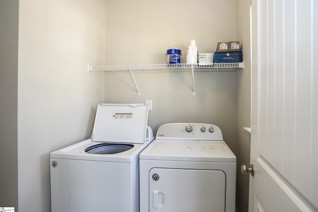 laundry room with separate washer and dryer