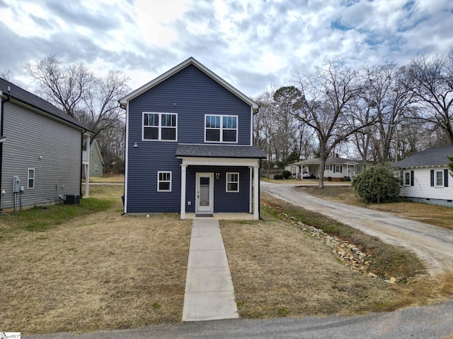 view of front of property with a front lawn