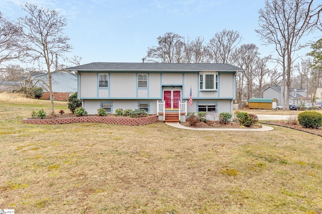 raised ranch featuring a front yard