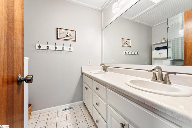 bathroom featuring tile patterned flooring and vanity