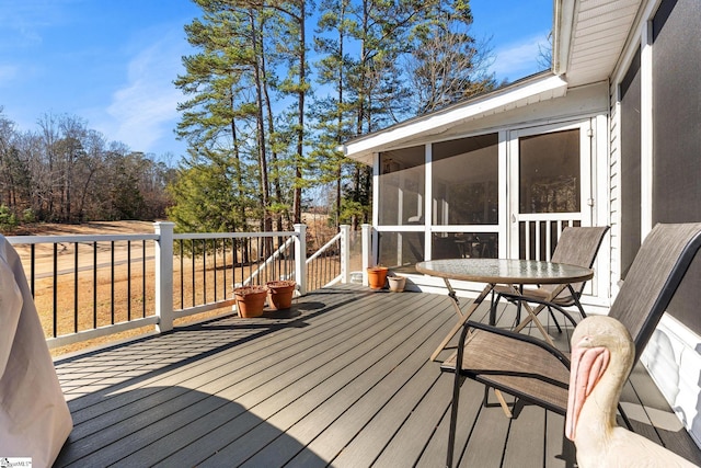 wooden terrace with a sunroom