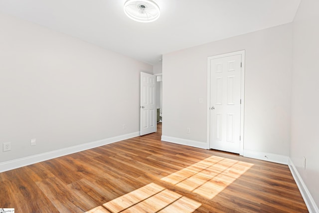 unfurnished bedroom featuring hardwood / wood-style flooring