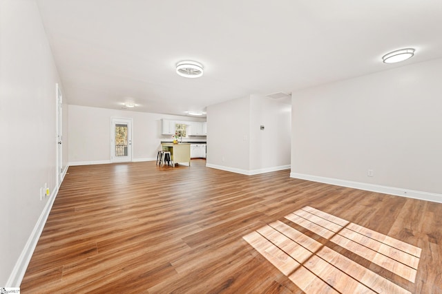 unfurnished living room featuring light wood-type flooring