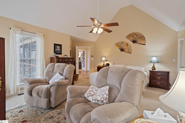 living room featuring ceiling fan, high vaulted ceiling, and light carpet