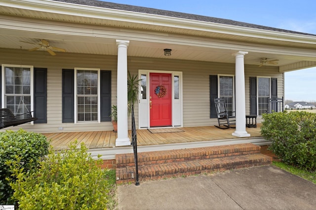 entrance to property featuring ceiling fan and a porch