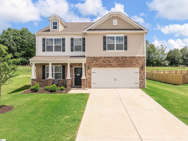 craftsman house featuring brick siding, concrete driveway, an attached garage, fence, and a front lawn