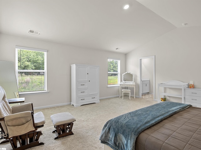 carpeted bedroom with visible vents, vaulted ceiling, and baseboards